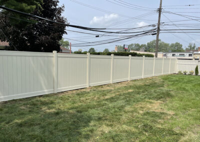 Vinyl privacy fence installed in a residential area